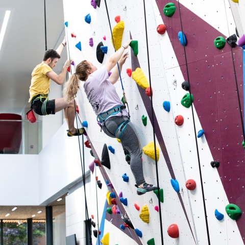 Students using the climbing wall at Ravelin Sports Centre