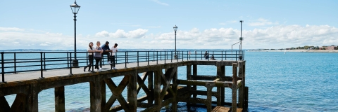 Students at the pier
